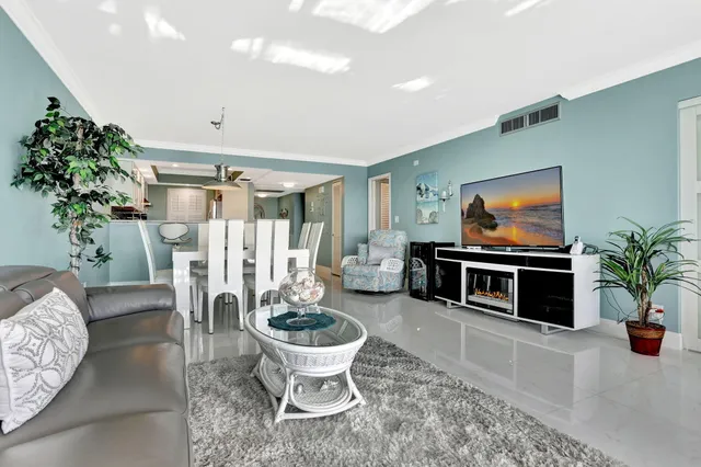 an aerial view of residential houses with outdoor space and street view