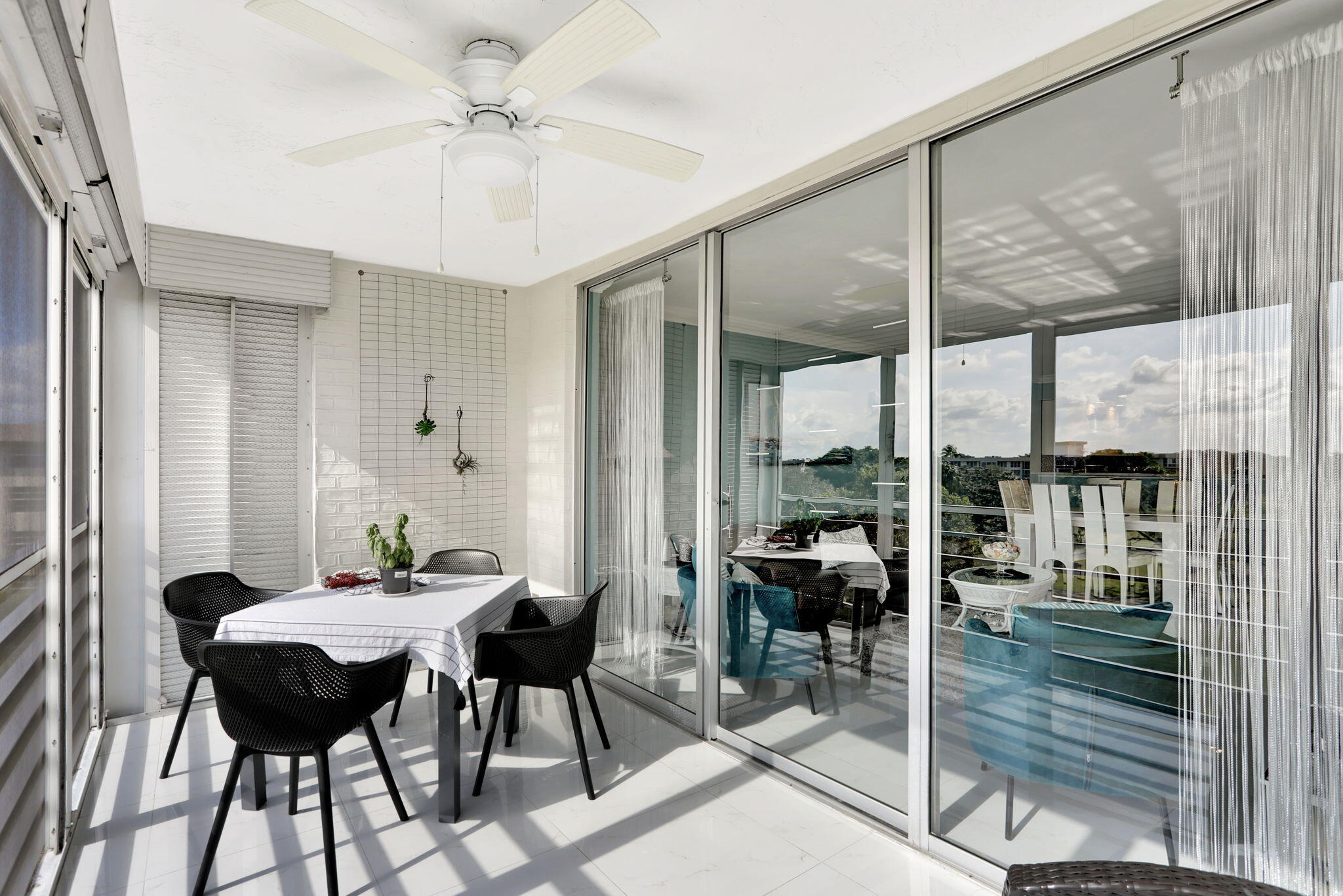 565 Oaks Lane, Unit 512 Pompano Beach, FL 33069 - Photo 24 of 34 a view of a dining room with furniture window and outside view