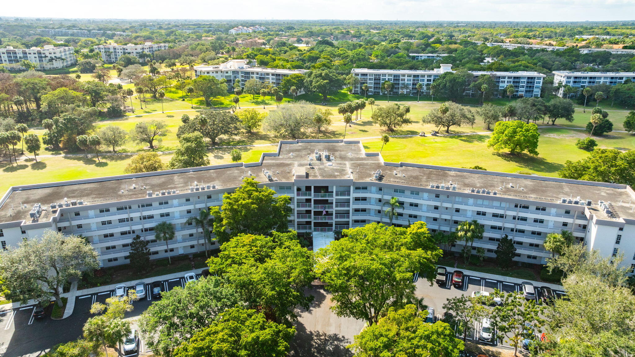 565 Oaks Lane, Unit 512 Pompano Beach, FL 33069 - Photo 31 of 34 a view of a lake with a mountain view