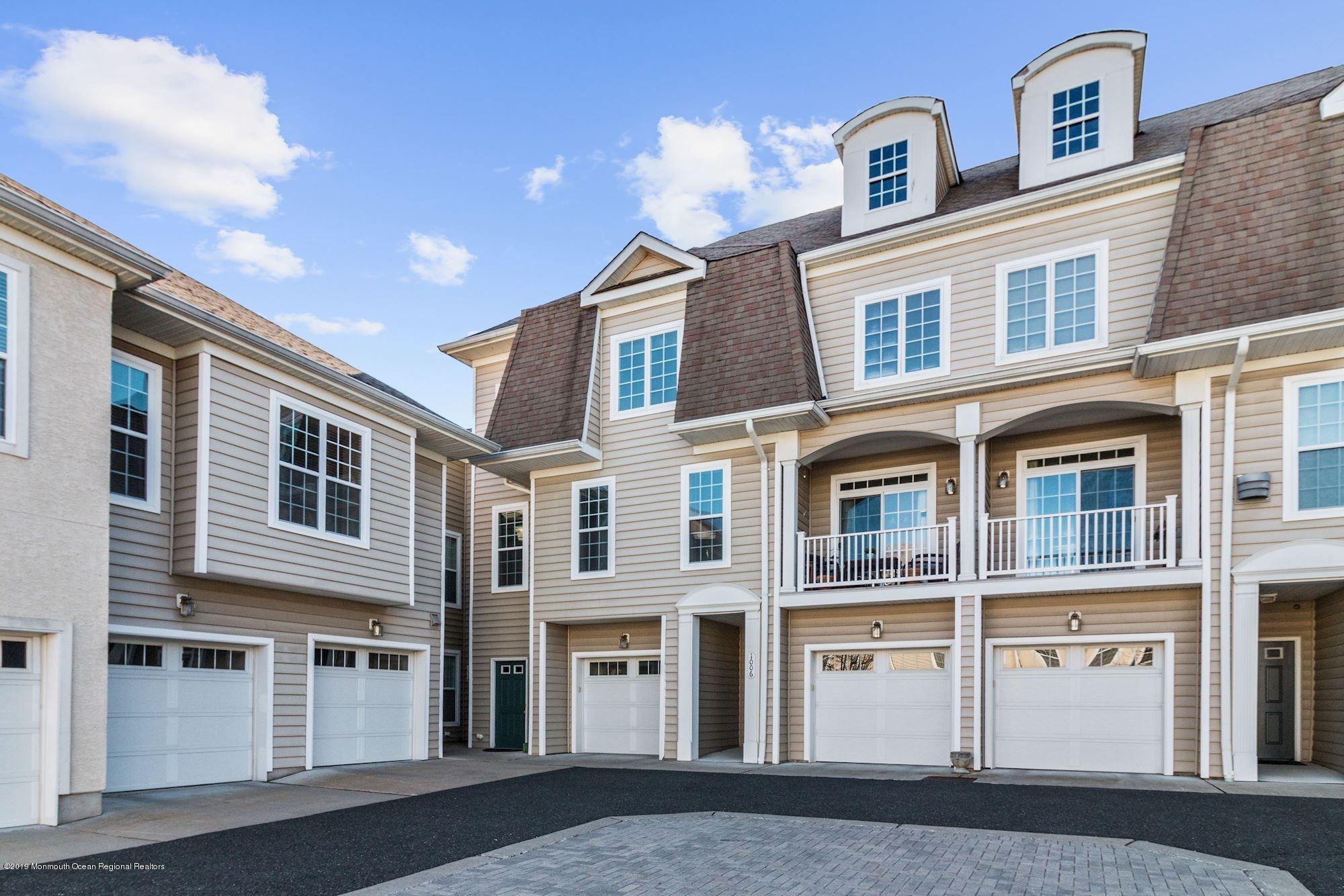 1006 Abby Road Middletown, NJ 07748 - Photo 1 of 44 a large building with a lot of windows