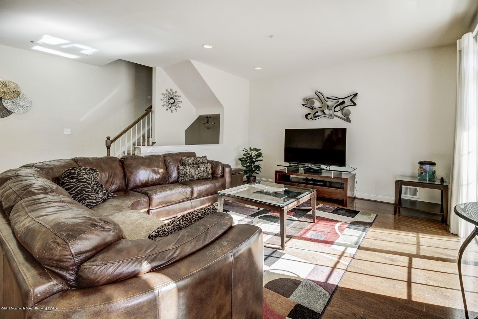 1006 Abby Road Middletown, NJ 07748 - Photo 11 of 44 a living room with furniture and a flat screen tv