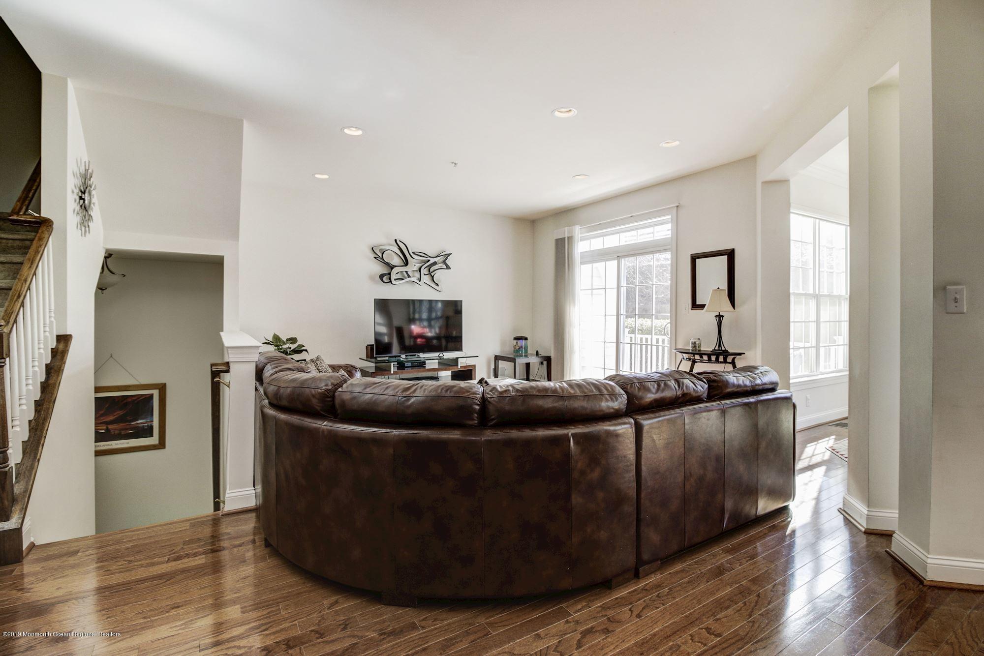 1006 Abby Road Middletown, NJ 07748 - Photo 12 of 44 a living room with furniture and a flat screen tv