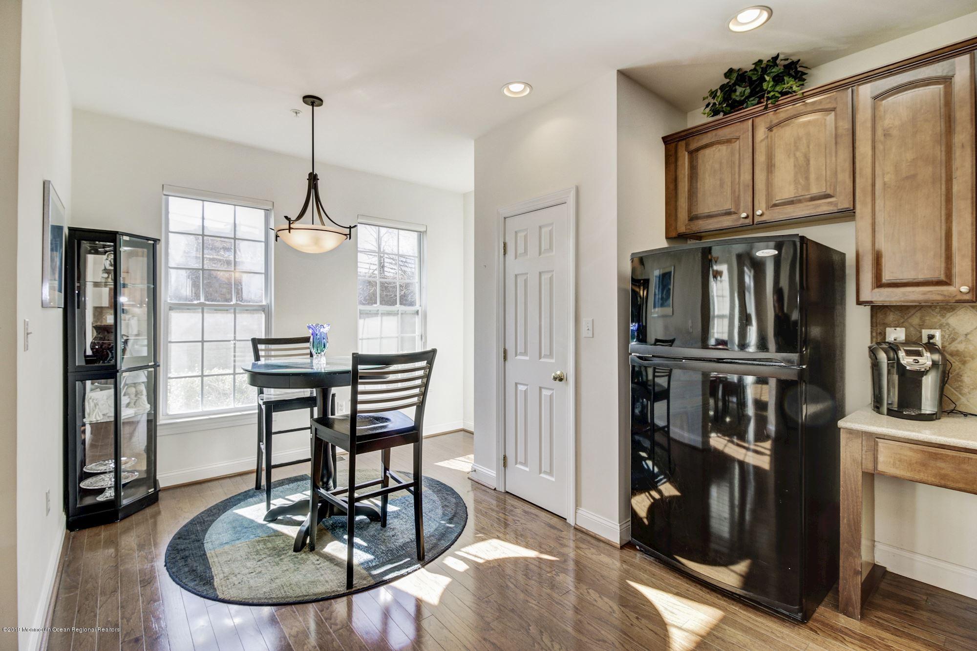 1006 Abby Road Middletown, NJ 07748 - Photo 20 of 44 a kitchen with stainless steel appliances granite countertop a refrigerator a stove and a wooden cabinets