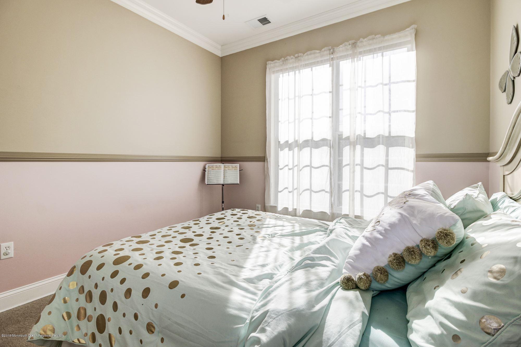 1006 Abby Road Middletown, NJ 07748 - Photo 29 of 44 a bedroom with a bed and a window