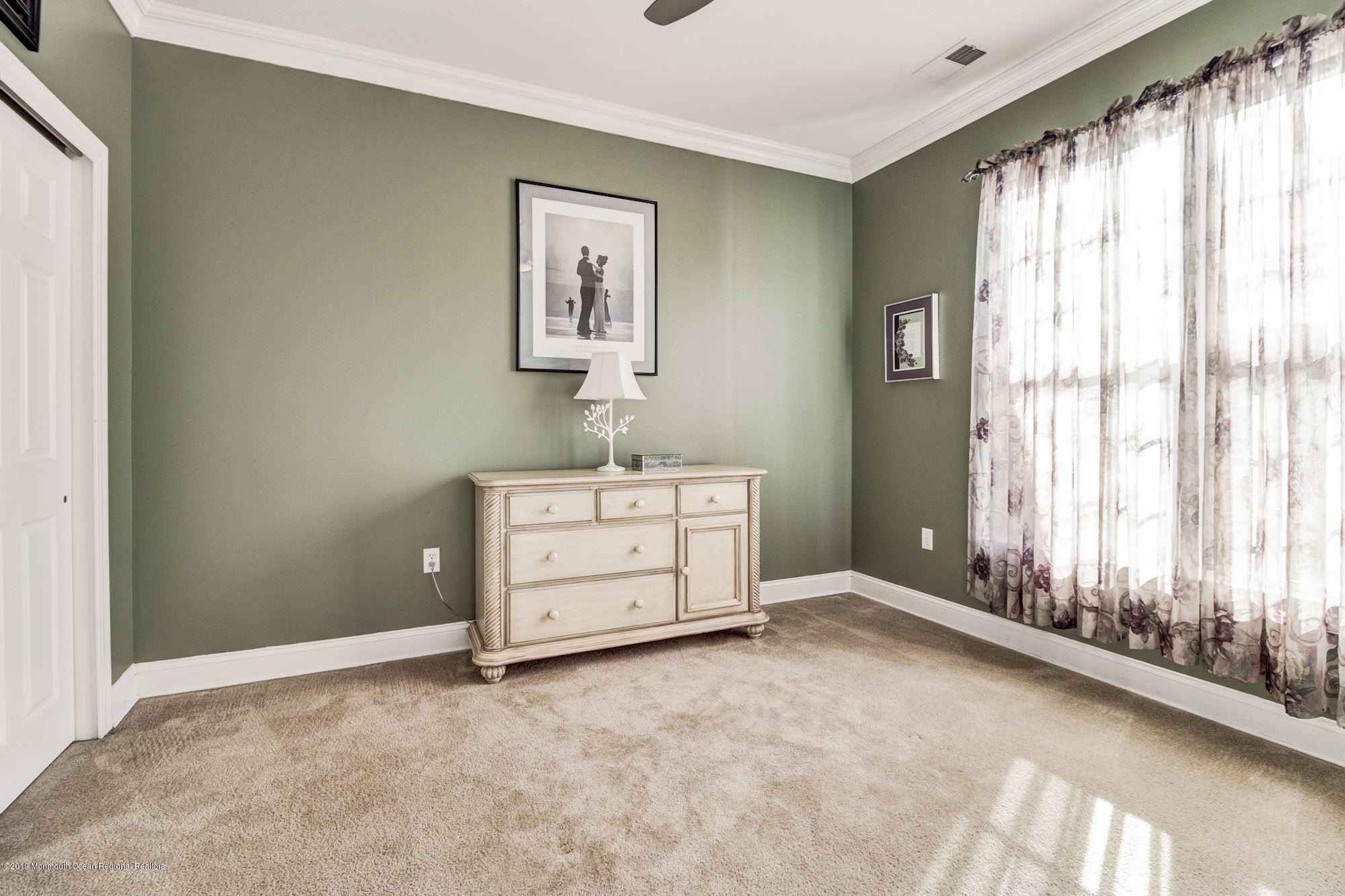 1006 Abby Road Middletown, NJ 07748 - Photo 33 of 44 a room with a dresser and a window