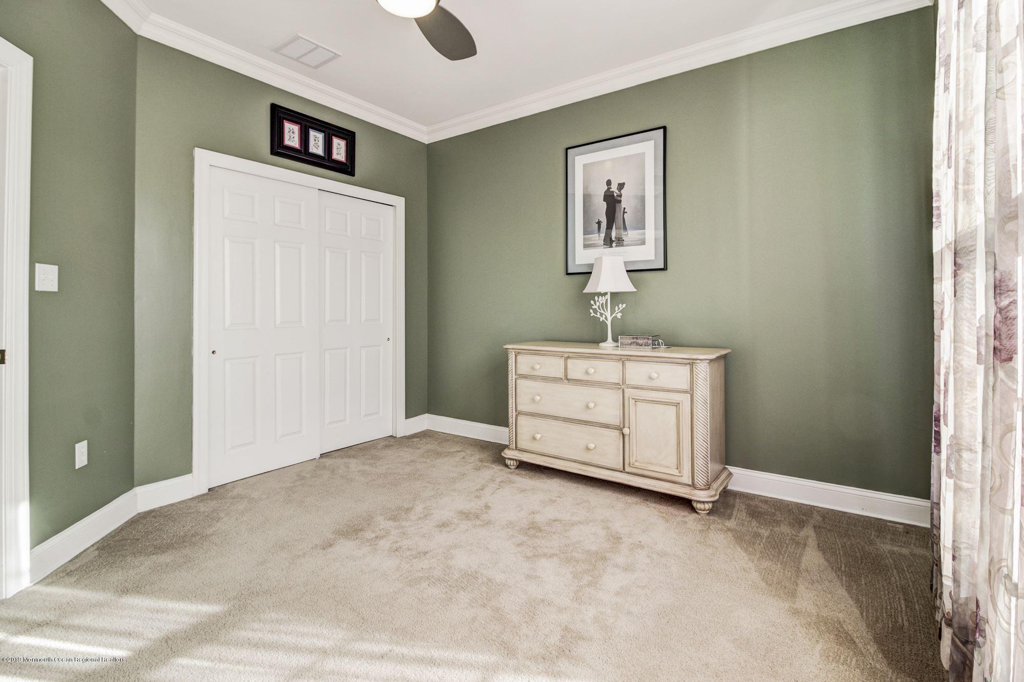 1006 Abby Road Middletown, NJ 07748 - Photo 34 of 44 a room that has a bed and a window