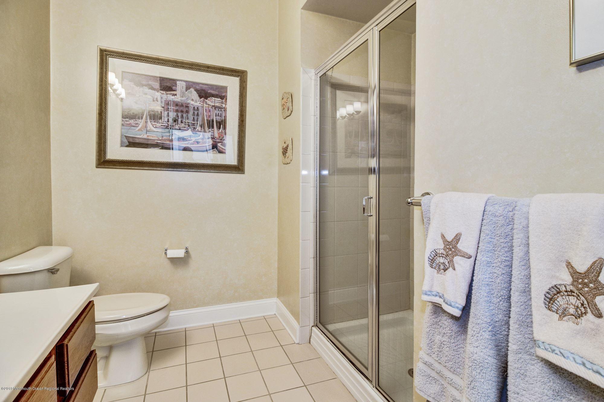 1006 Abby Road Middletown, NJ 07748 - Photo 36 of 44 a bathroom with a shower and toilet