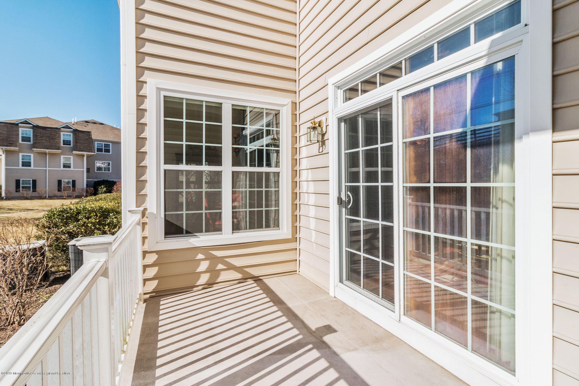 1006 Abby Road Middletown, NJ 07748 - Photo 43 of 44 a view of a balcony with a window