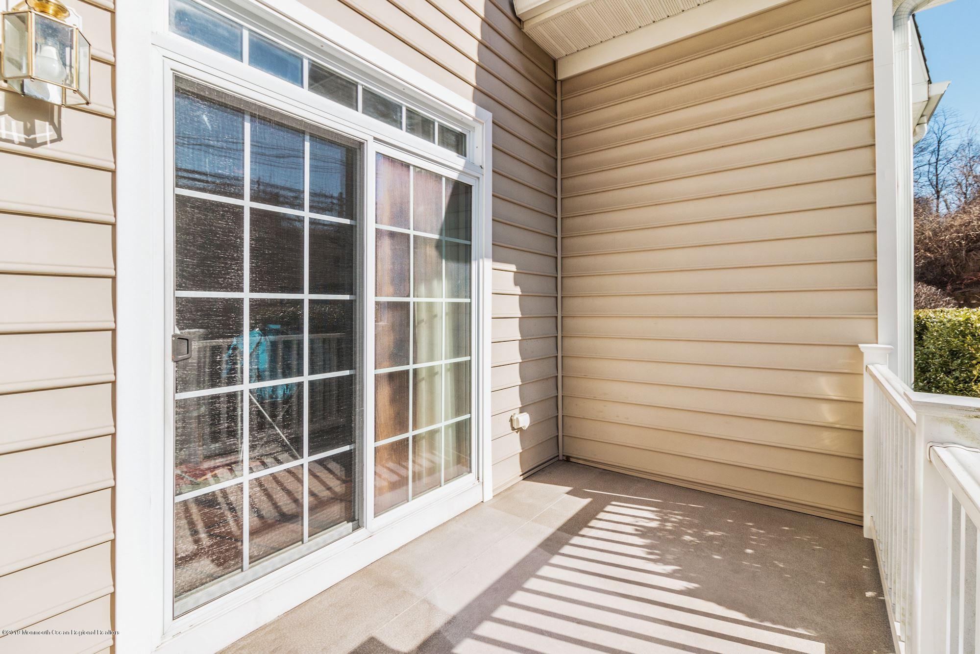 1006 Abby Road Middletown, NJ 07748 - Photo 44 of 44 a view of a balcony with door