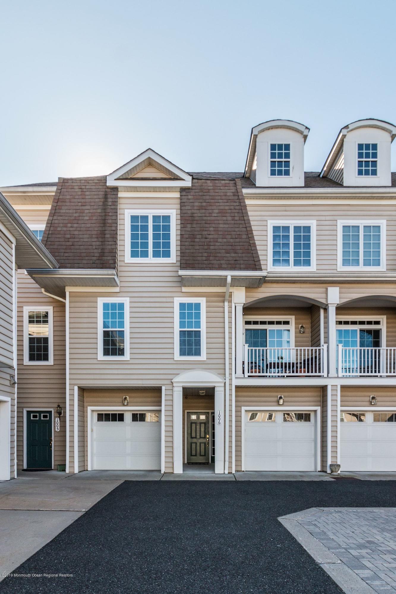 1006 Abby Road Middletown, NJ 07748 - Photo 5 of 44 a view of a brick house with large windows