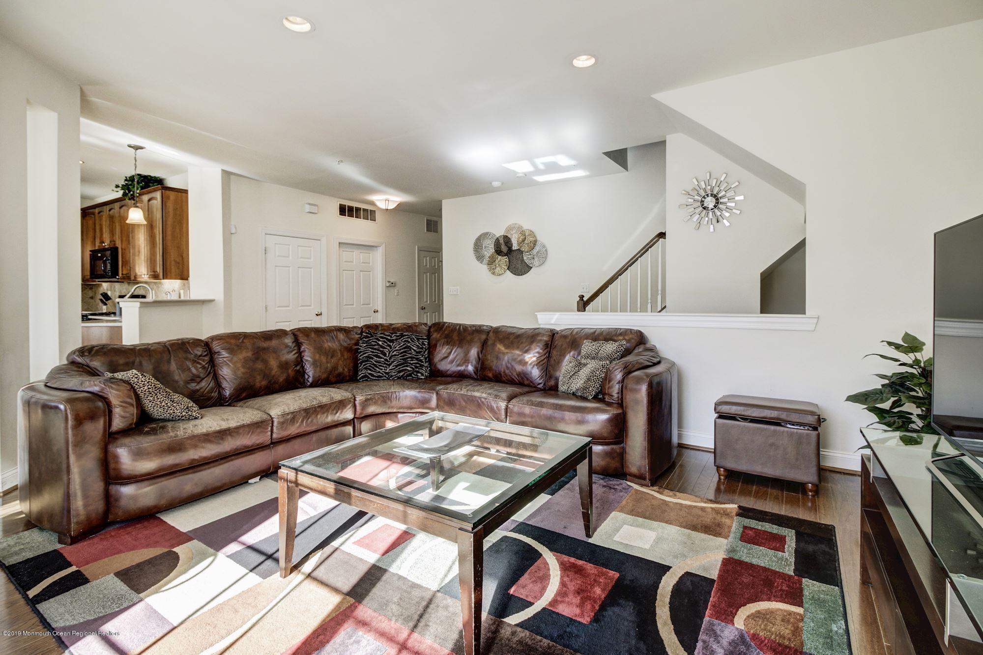 1006 Abby Road Middletown, NJ 07748 - Photo 8 of 44 a living room with furniture and a rug