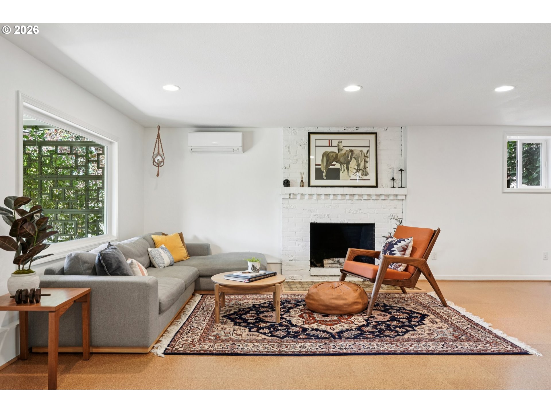 7225 Southwest 13th Avenue Portland, OR 97219 - Photo 35 of 48 a living room with furniture and a fireplace