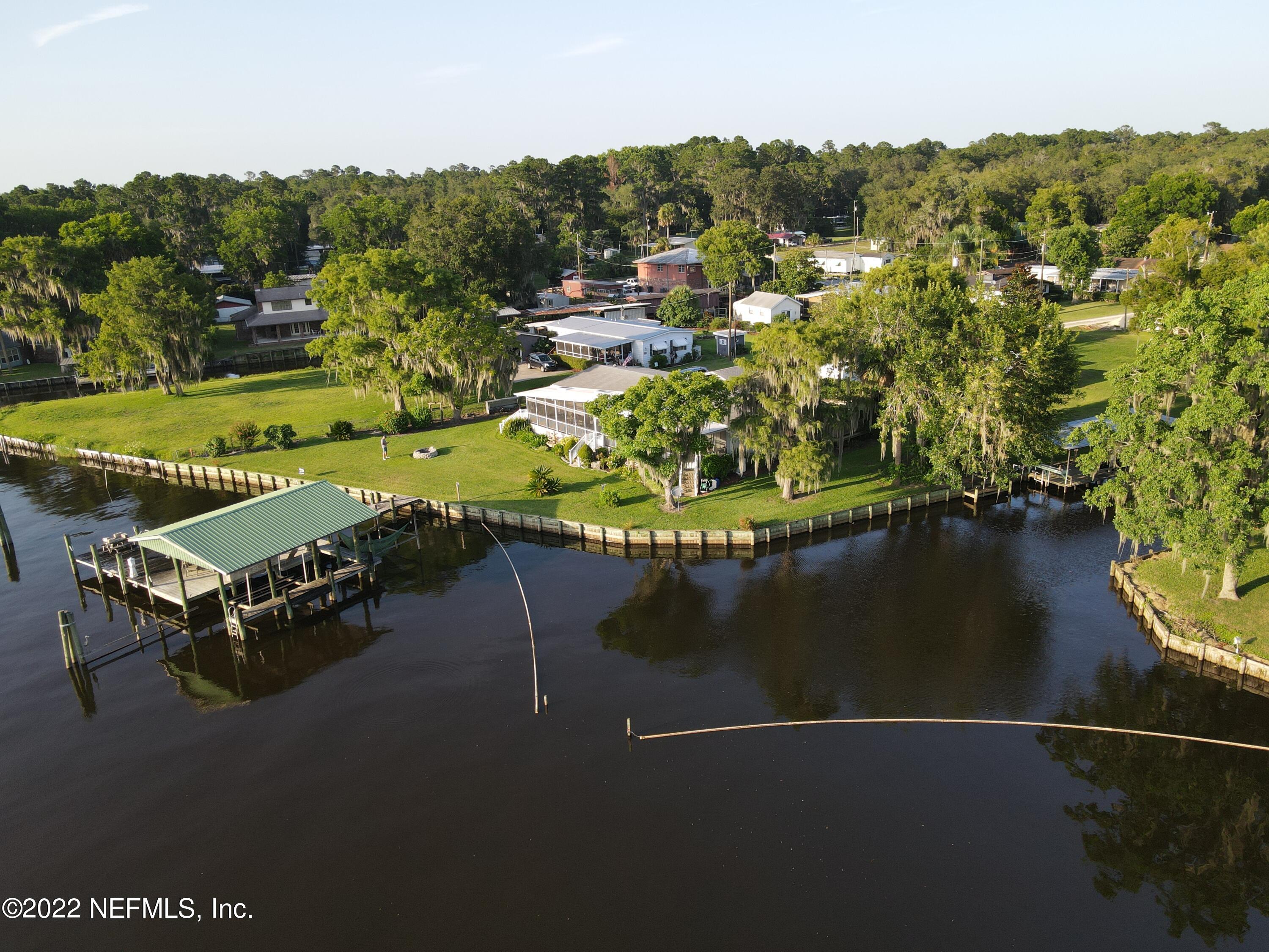 121 Jimmie Road Crescent City, FL 32112 - Photo 1 of 45 an aerial view of a house with a lake view