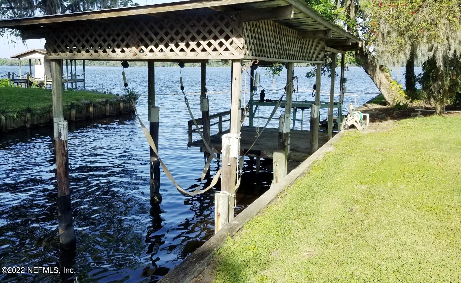 121 Jimmie Road Crescent City, FL 32112 - Photo 13 of 45 a view of a patio with chairs and iron fence