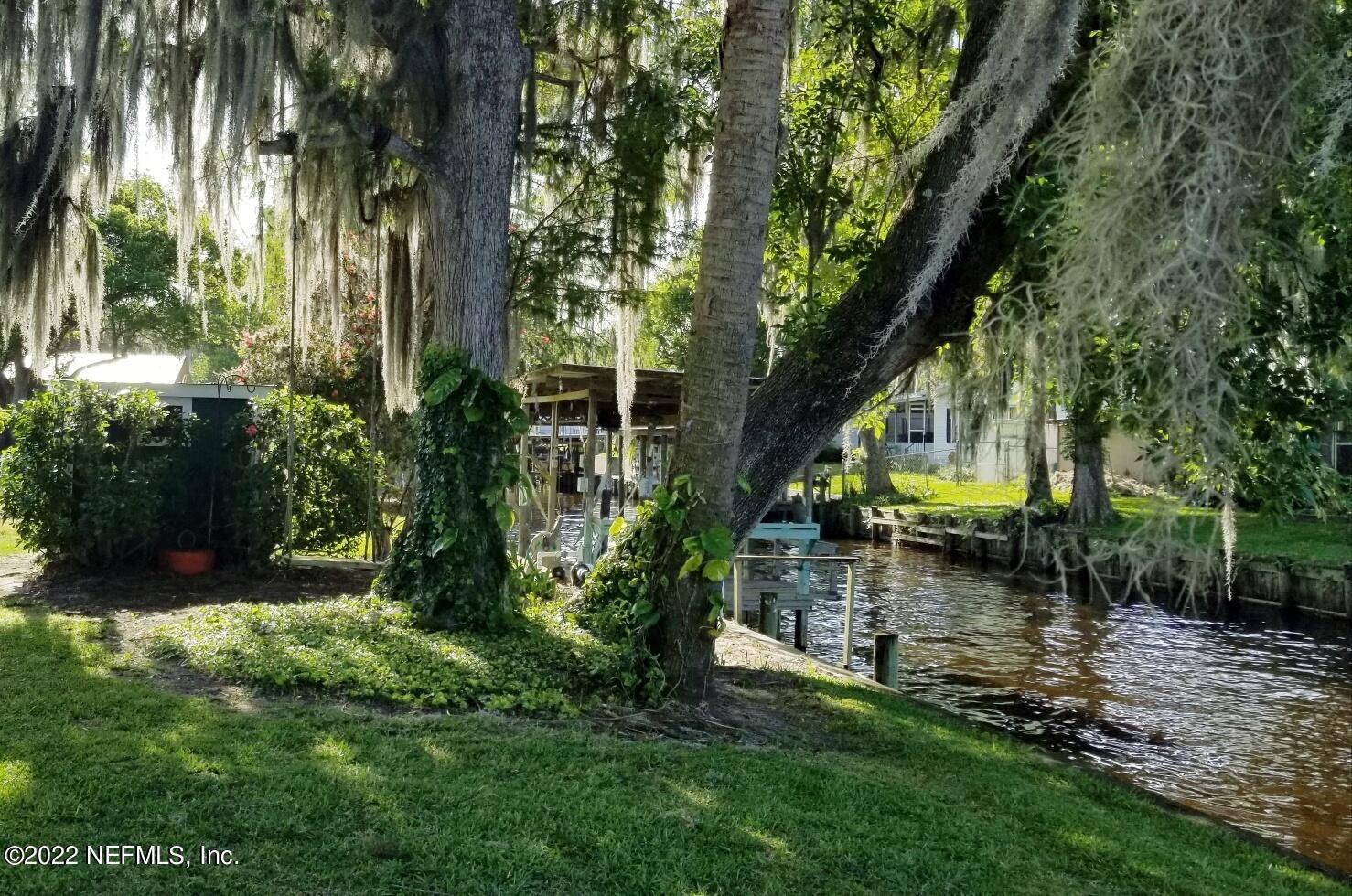 121 Jimmie Road Crescent City, FL 32112 - Photo 15 of 45 a backyard of a house with lots of green space