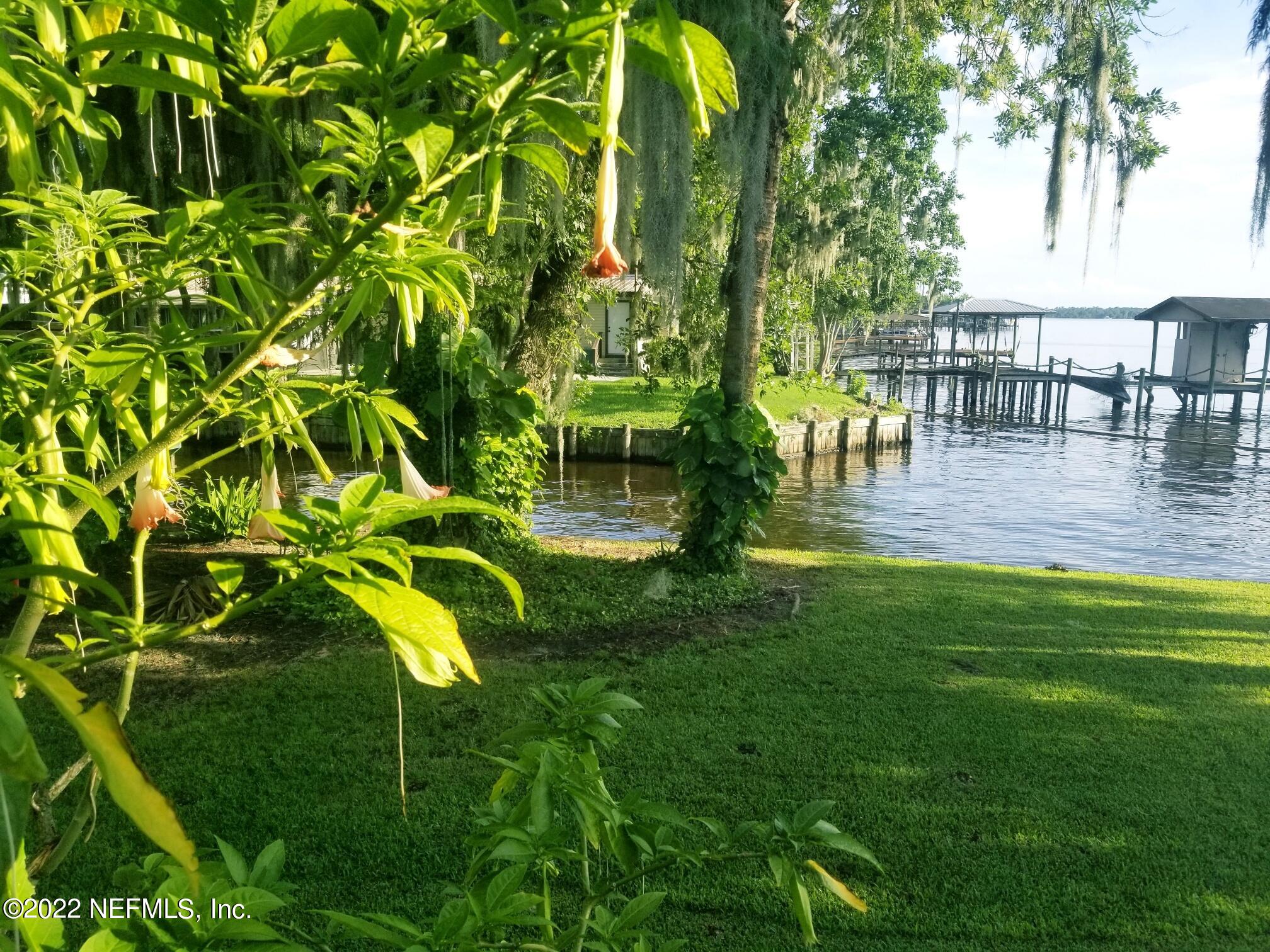 121 Jimmie Road Crescent City, FL 32112 - Photo 16 of 45 a view of swimming pool with lawn chairs and a yard