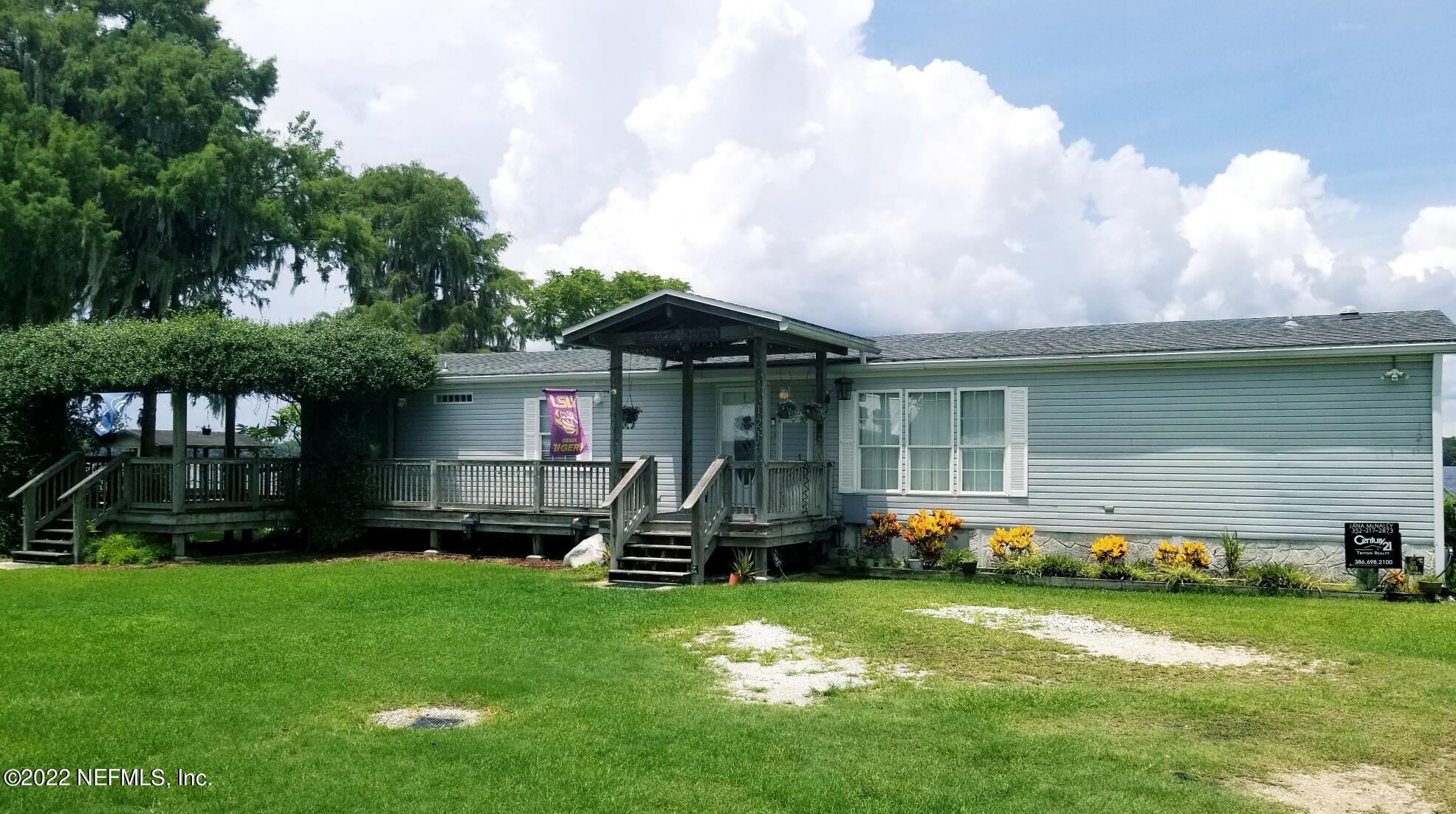 121 Jimmie Road Crescent City, FL 32112 - Photo 17 of 45 a front view of house with yard and outdoor seating
