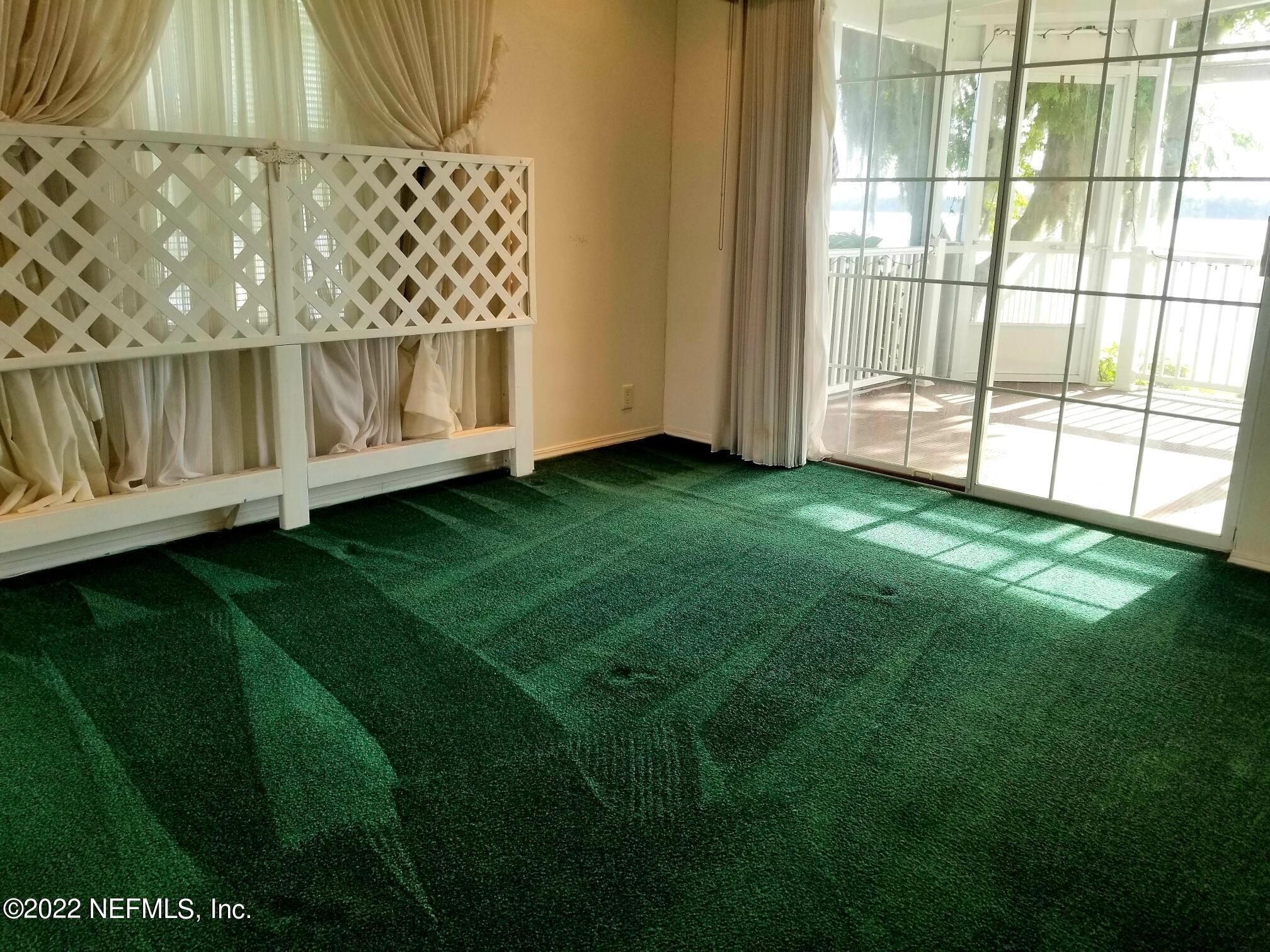 121 Jimmie Road Crescent City, FL 32112 - Photo 28 of 45 a view of a backyard with wooden fence