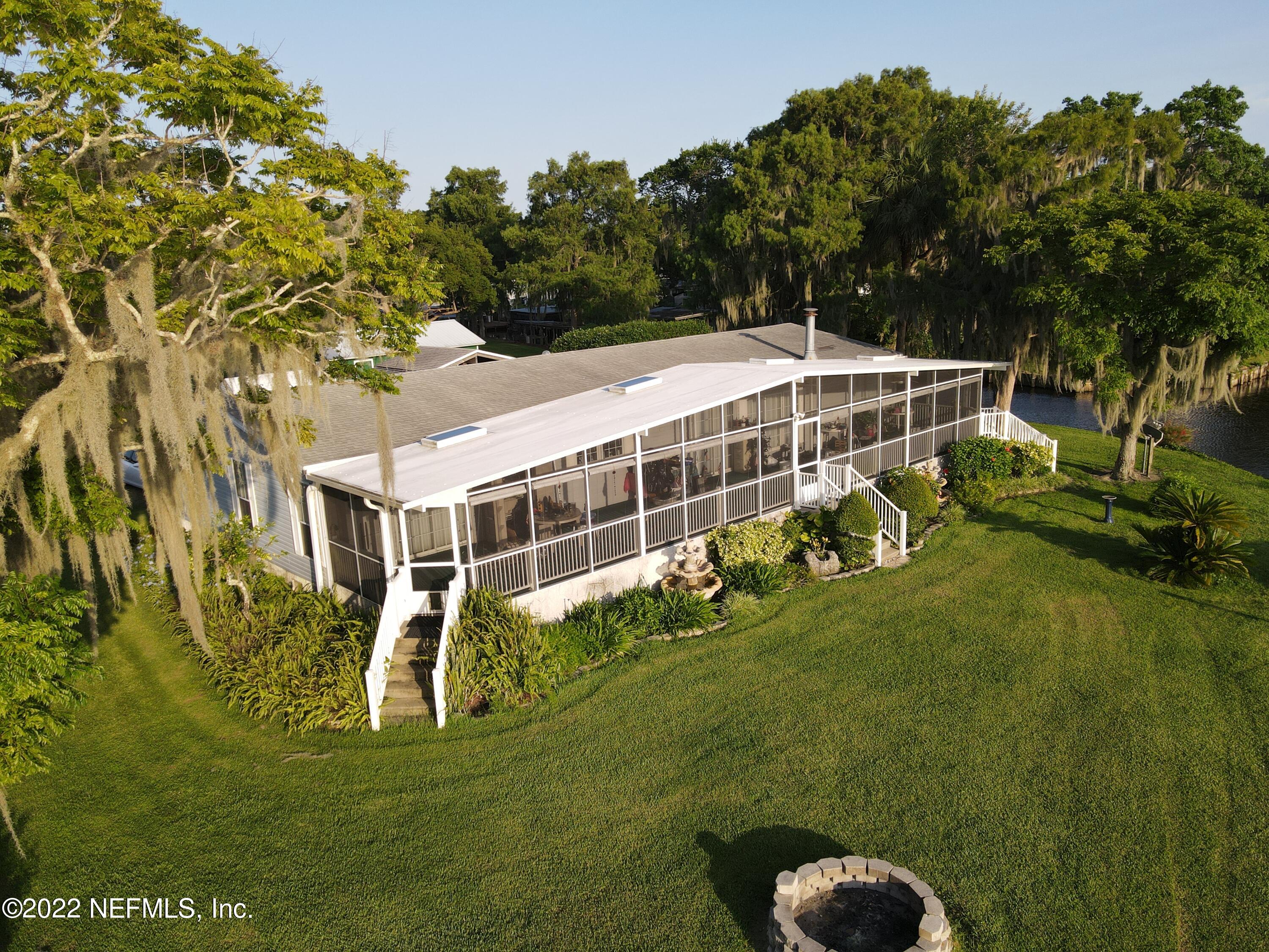 121 Jimmie Road Crescent City, FL 32112 - Photo 4 of 45 a view of a house with a big yard