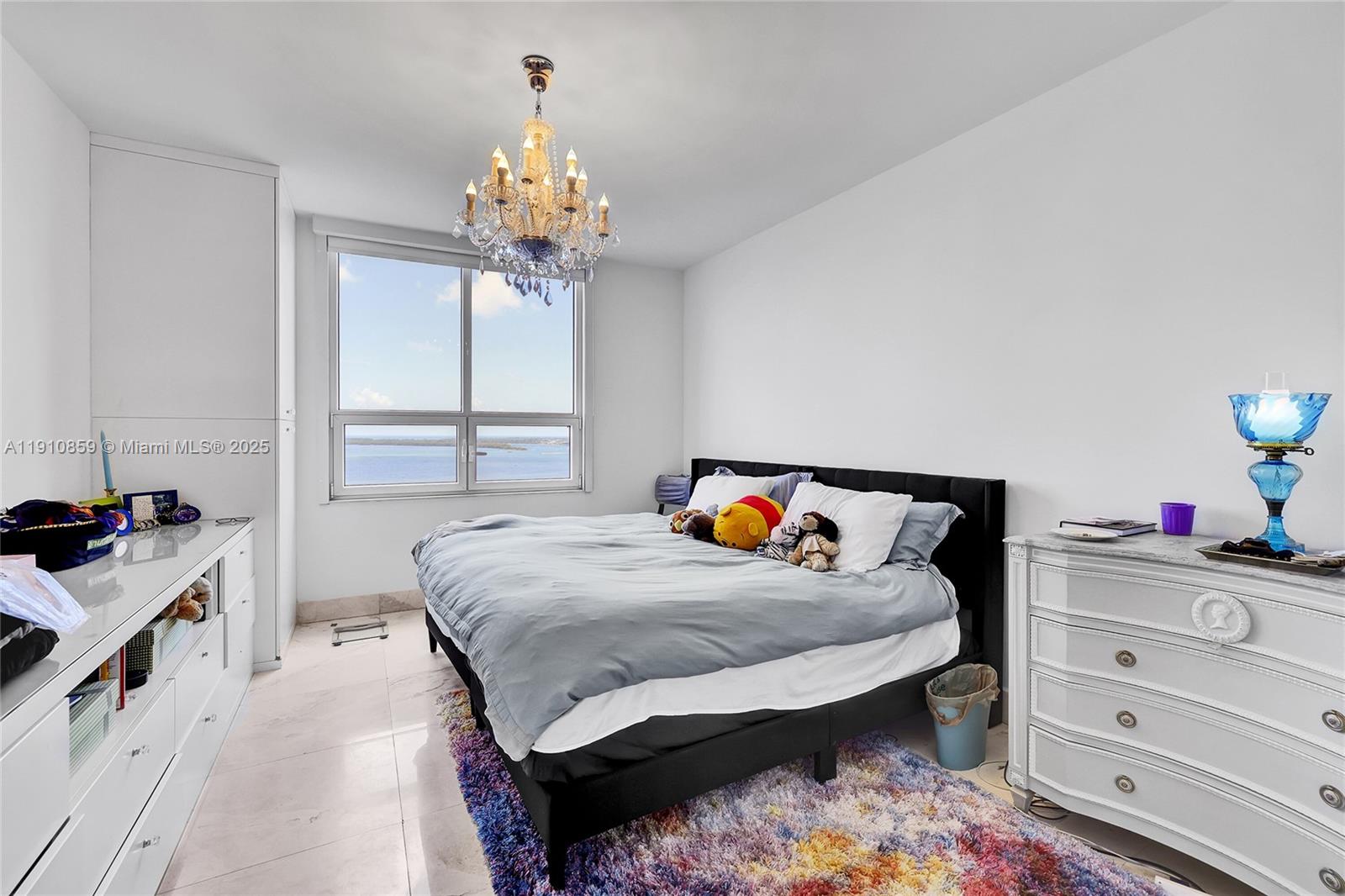 808 Brickell Key Drive, Unit 2104 Miami, FL 33131 - Photo 13 of 29 a bedroom with a bed and a window