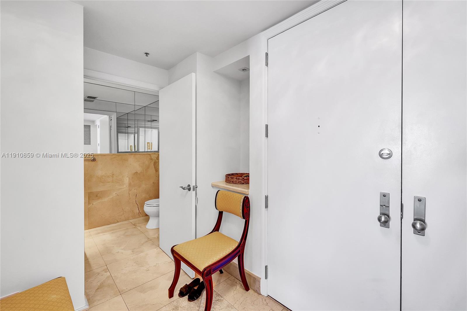 808 Brickell Key Drive, Unit 2104 Miami, FL 33131 - Photo 17 of 29 a bathroom with a toilet and a mirror