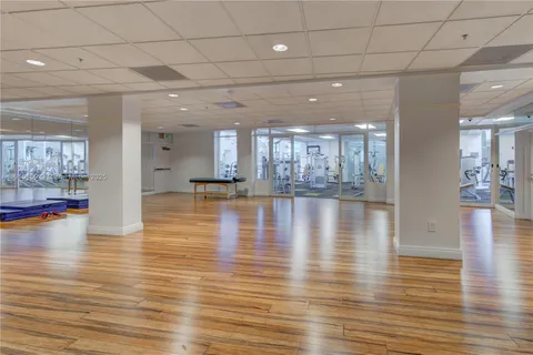 a workspace with furniture and wooden floor