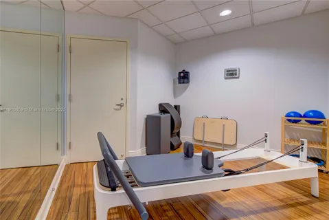 an empty room with a ceiling fan and painted walls