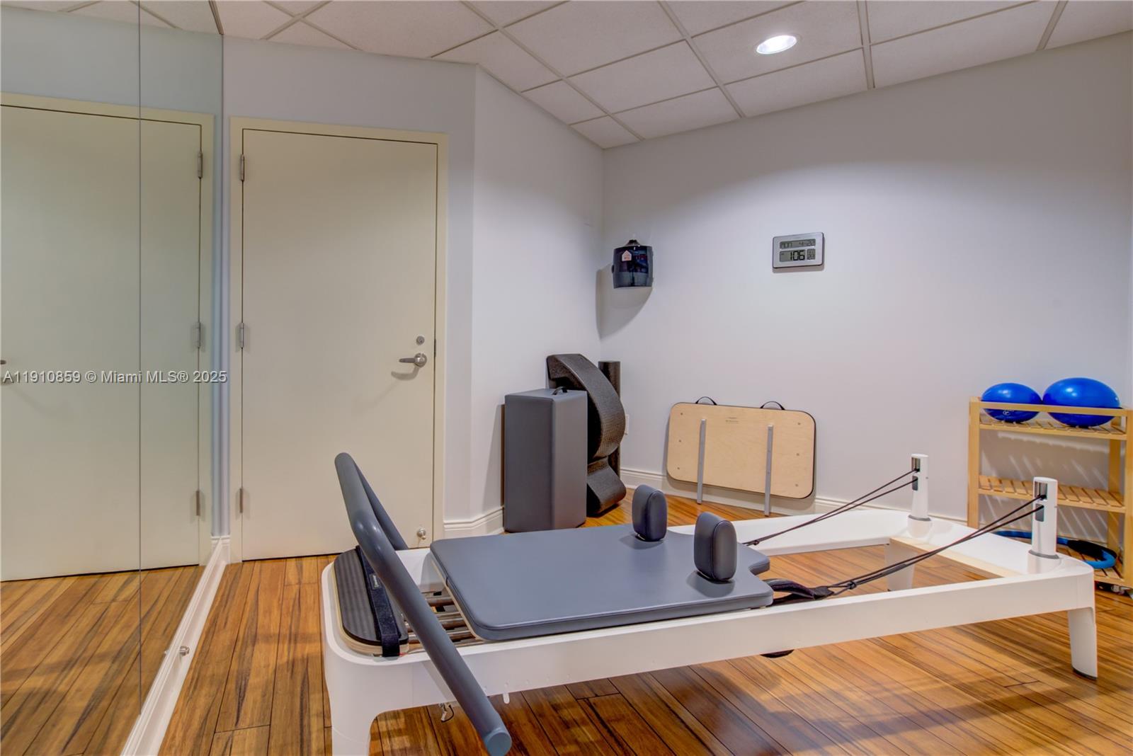 808 Brickell Key Drive, Unit 2104 Miami, FL 33131 - Photo 27 of 29 a workspace with furniture and wooden floor