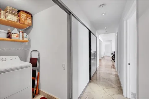 a view of hallway with washer and dryer