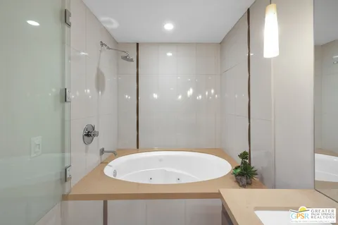 a bathroom with a bathtub and shower