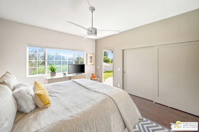 a bedroom with a bed window and a table