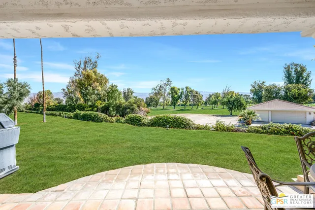 a view of a garden with a bench