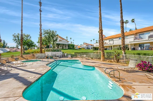 a view of a swimming pool with a patio