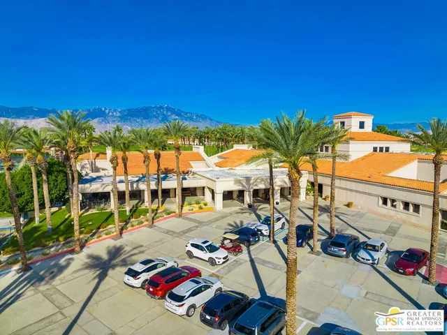 a view of multiple houses with swimming pool