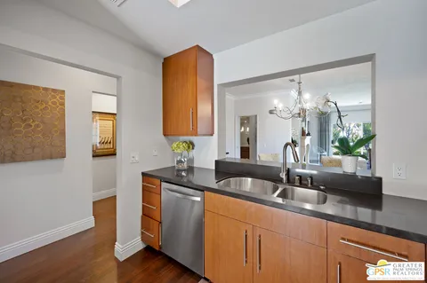 a bathroom with double vanity and a mirror