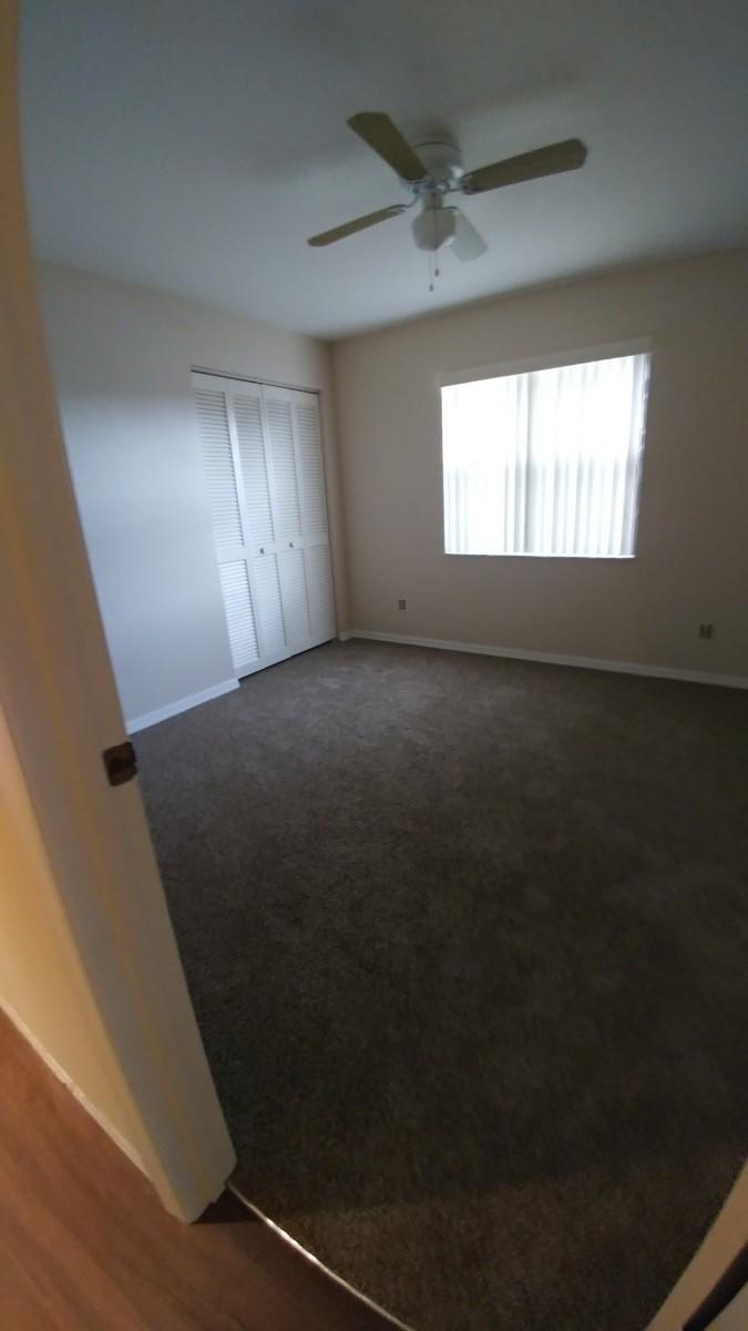 1841 Southwest Palm City Road, Unit D102 Stuart, FL 34994 - Photo 11 of 17 a view of an empty room and window