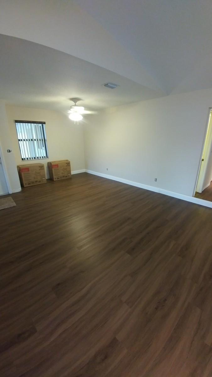 1841 Southwest Palm City Road, Unit D102 Stuart, FL 34994 - Photo 12 of 17 a view of a livingroom with wooden floor