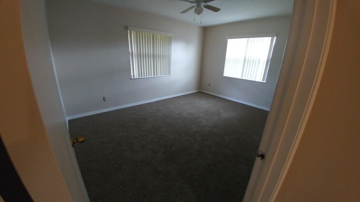1841 Southwest Palm City Road, Unit D102 Stuart, FL 34994 - Photo 3 of 17 an empty room with a window