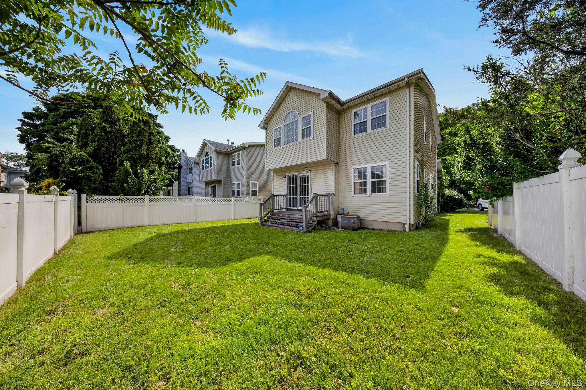 82 B Inwood Road Port Washington, NY 11050 - Photo 34 of 41 a view of an house with backyard and garden