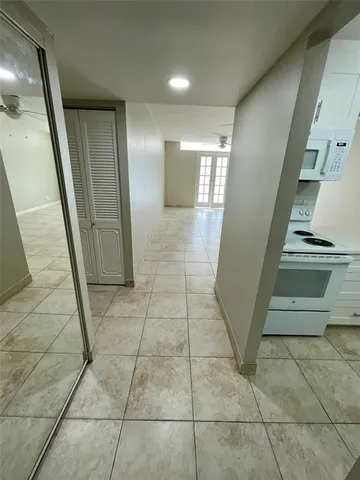 an empty room with wooden floor