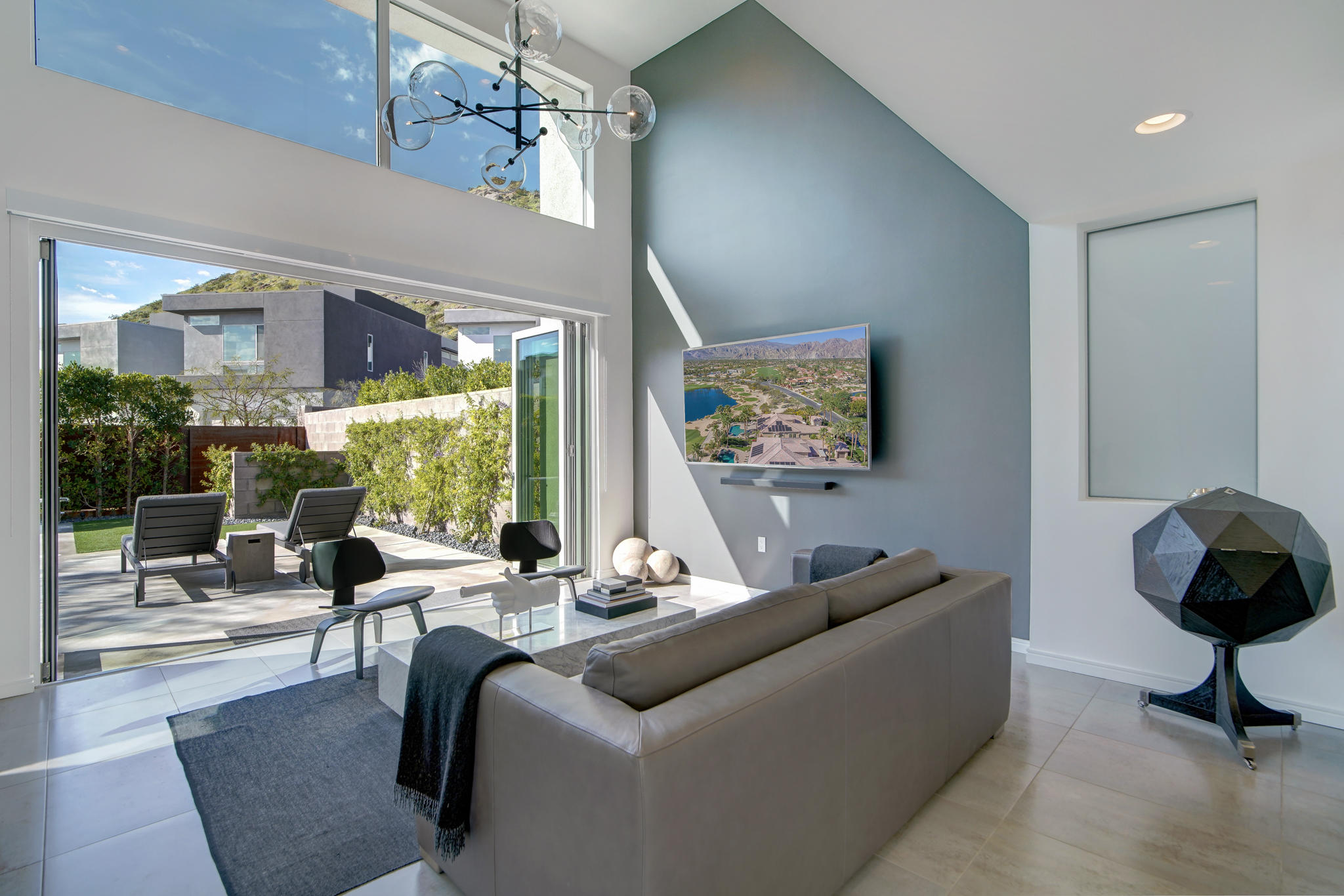 305 Goleta Way Palm Springs, CA 92264 - Photo 14 of 34 a living room with furniture and a floor to ceiling window