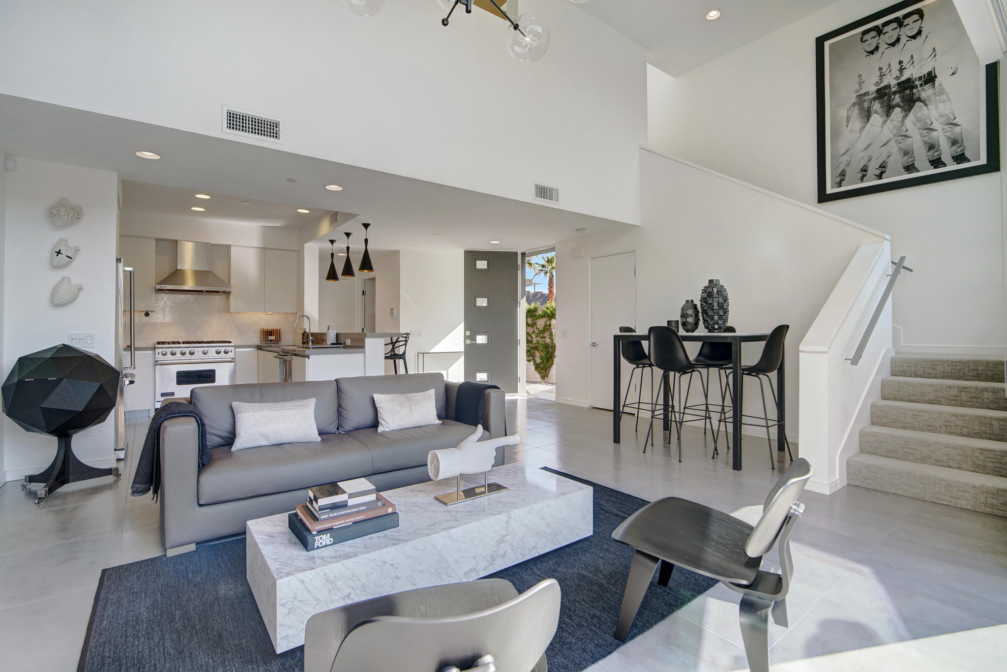 305 Goleta Way Palm Springs, CA 92264 - Photo 15 of 34 a living room with furniture kitchen view and a dining table