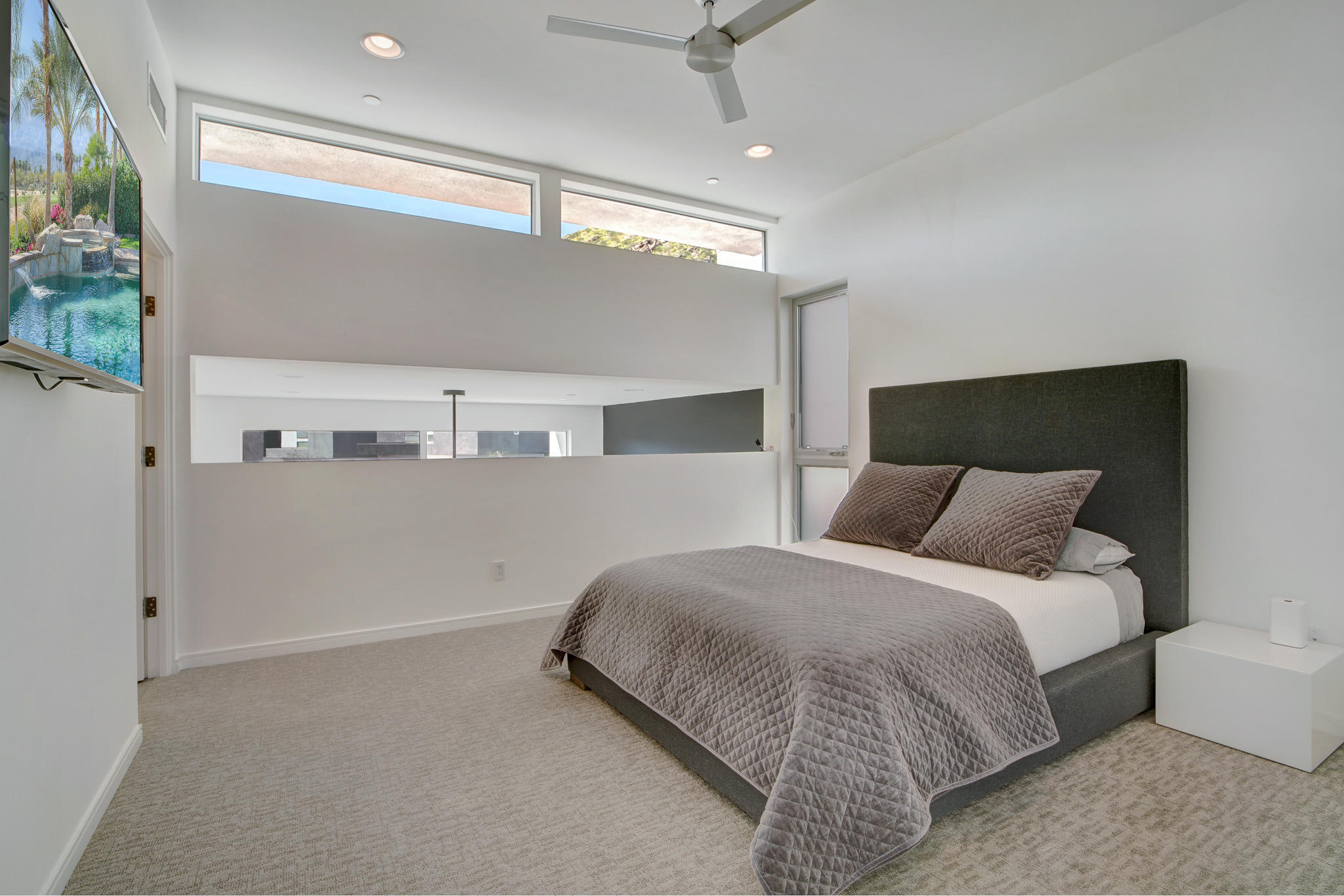 305 Goleta Way Palm Springs, CA 92264 - Photo 21 of 34 a bedroom with a bed and a ceiling fan