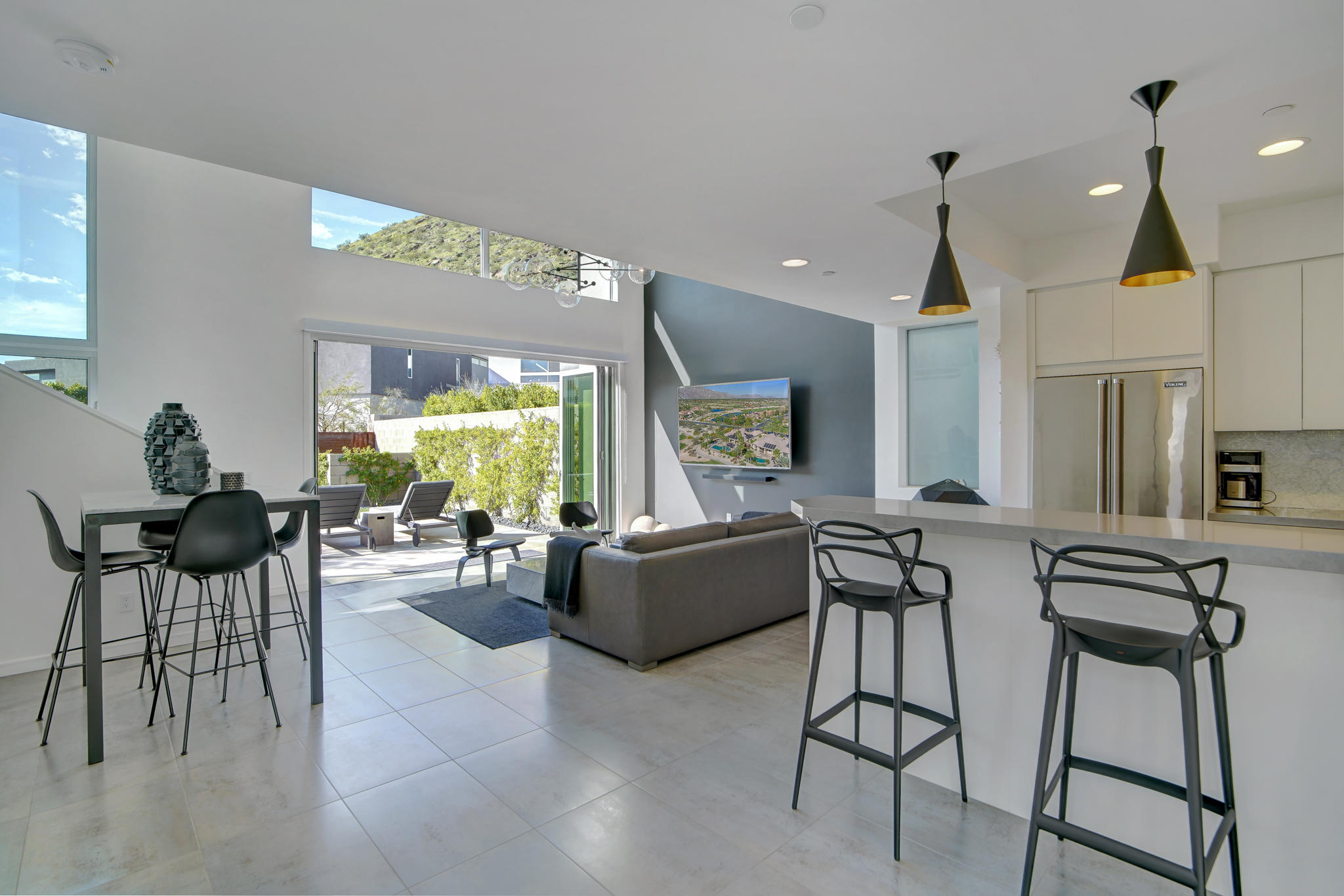 305 Goleta Way Palm Springs, CA 92264 - Photo 8 of 34 a living room with fireplace furniture and a large window