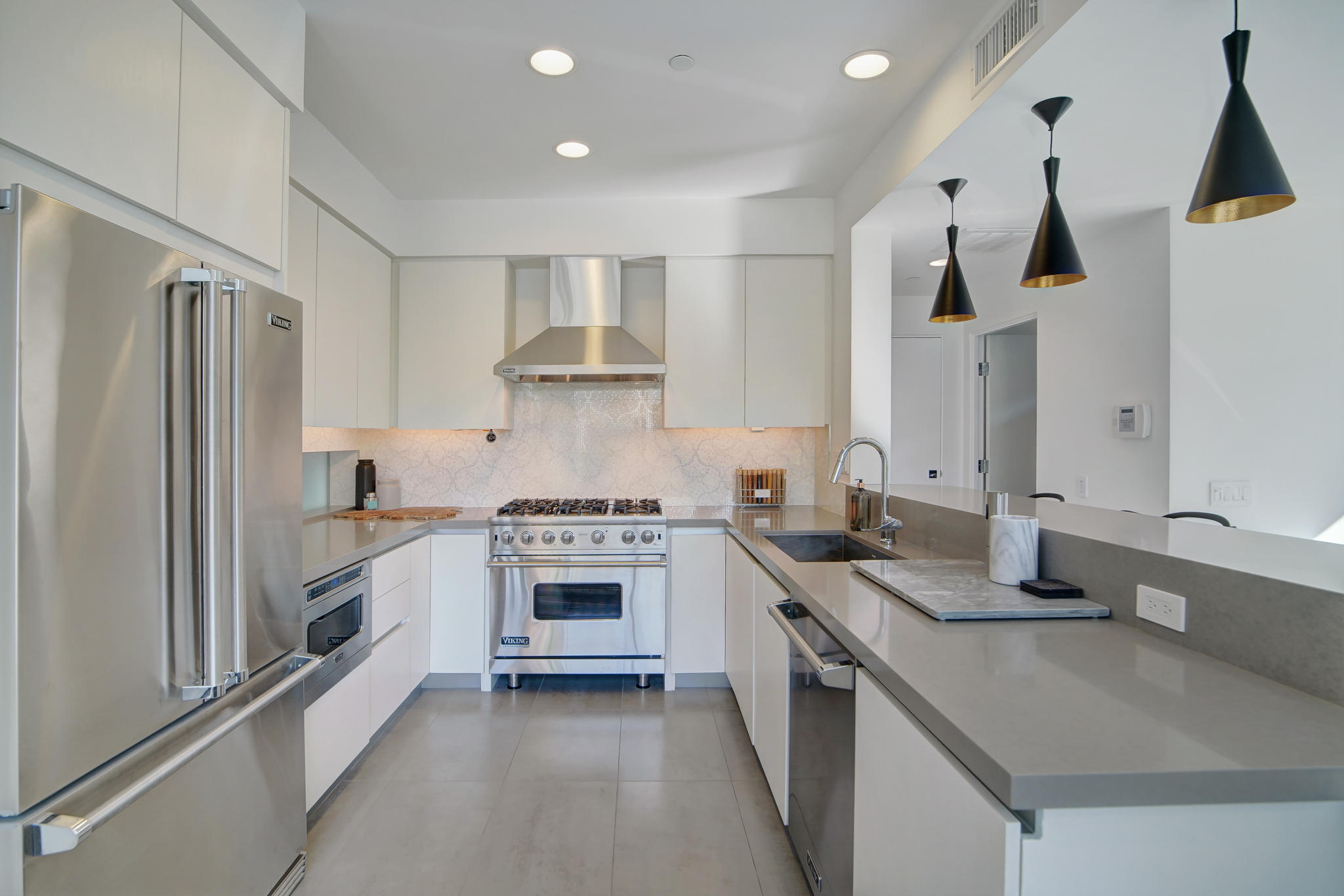 305 Goleta Way Palm Springs, CA 92264 - Photo 10 of 34 a kitchen with stainless steel appliances granite countertop a sink stove and refrigerator