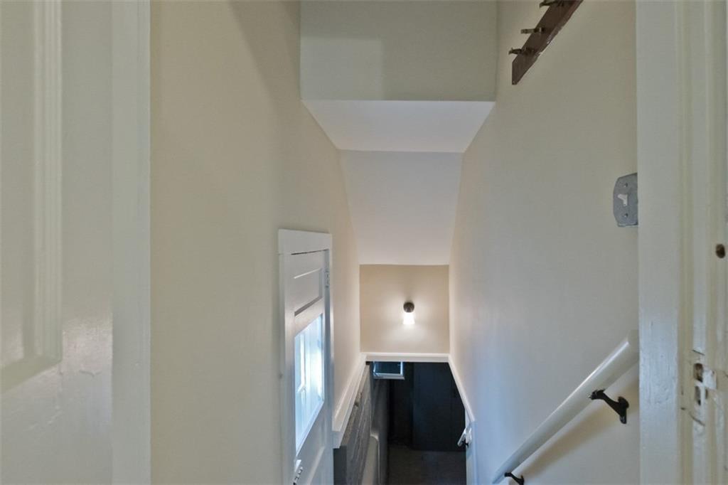 75 Codman Street Portland, ME 04103 - Photo 25 of 29 Stairs to basement and exterior door