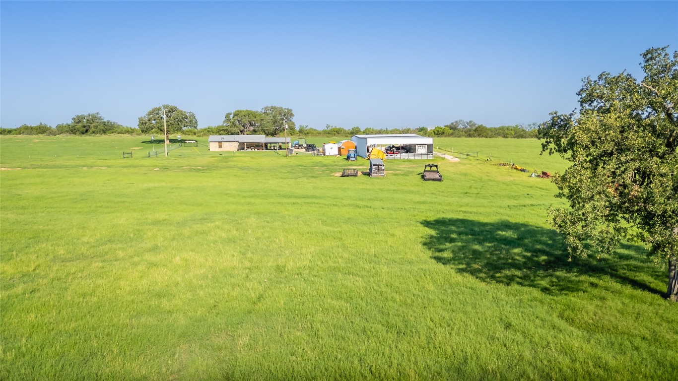 1483 County Road 255 Rochelle, TX 76872 - Photo 27 of 33 a view of a big yard with an outdoor space and seating area