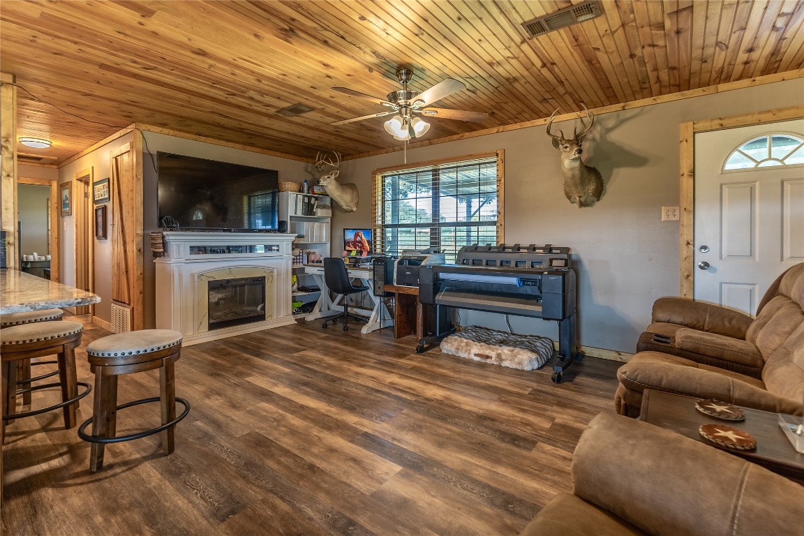 1483 County Road 255 Rochelle, TX 76872 - Photo 7 of 33 a living room with furniture a flat screen tv and a fireplace
