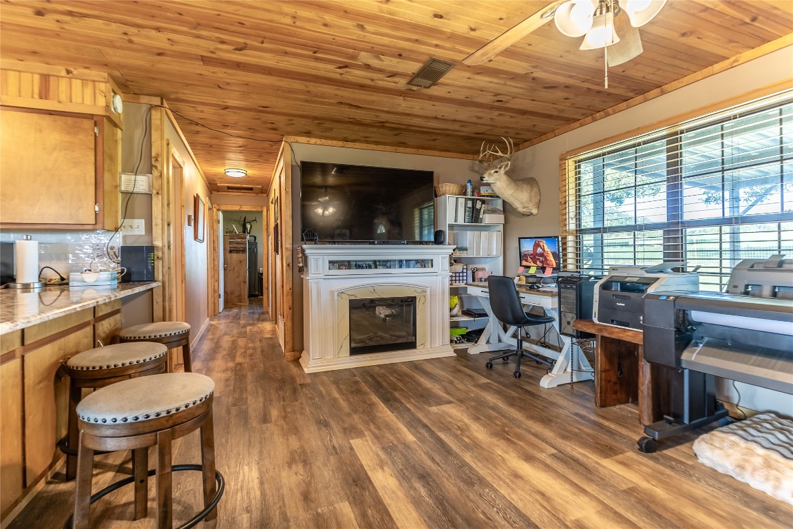 1483 County Road 255 Rochelle, TX 76872 - Photo 8 of 33 a living room with furniture a flat screen tv and a fireplace
