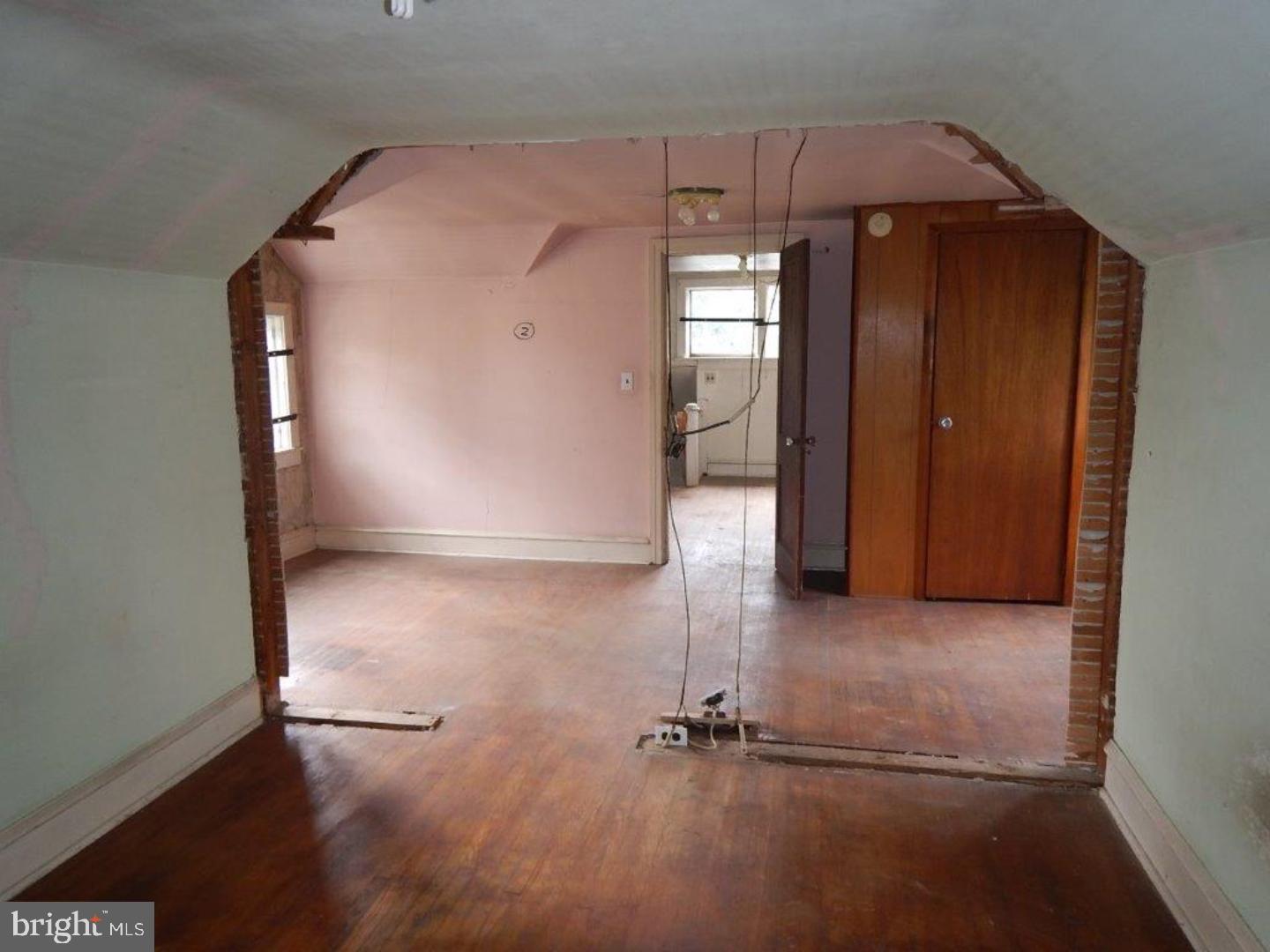 610 Good Intent Road Blackwood, NJ 08012 - Photo 9 of 14 an empty room with wooden floor and windows
